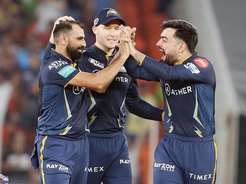 Gujarat Titans' Mohammad Shami (left) celebrates the dismissal of Mumbai Indians skipper Rohit Sharma during the IPL second qualifier match at Narendra Modi Stadium in Ahmedabad on Friday. 