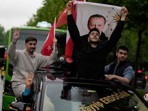 Supporters of the President Recep Tayyip Erdogan celebrate outside AK Party offices in Istanbul, Turkey, Sunday, May 28, 2023. 