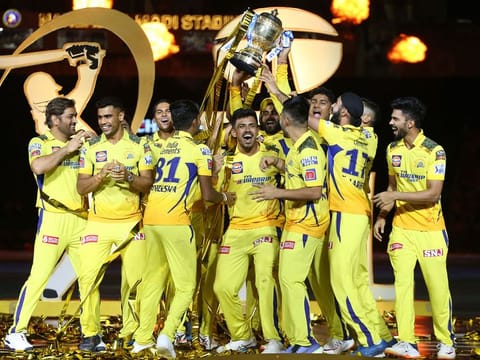 Chennai Super Kings’ players celebrate with the trophy after being crowned champions in the Tata Indian Premier League at the Narendra Modi Stadium in Ahmedabad on May 29, 2023. They defeated the Gujarat Titans by five wickets in the final. 