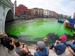 Photos: Venice's Grand Canal turns bright green due to fluorescein