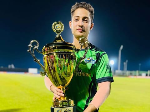 Mohammad Faraazuddin holds the winners' trophy after guiding Fujairah to victory in the Emirates D50 tournament. 