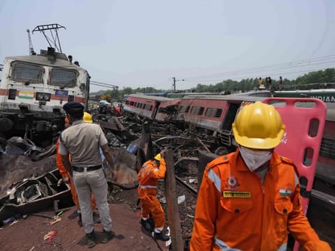 Rescuers work at the site of passenger trains that derailed in Balasore district, in the eastern Indian state of Orissa, on Saturday, June 3, 2023.  