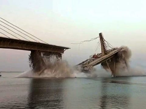 This photo taken on June 4, 2023, shows an under construction bridge collapsing into the river Ganges in Bhagalpur district in India's eastern state of Bihar. 