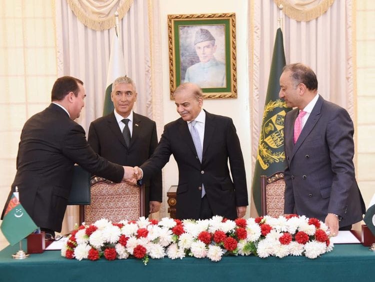 Pakistan’s Prime Minister Shehbaz Sharif and Turkmenistan State Minister Maksat Babayev shake hands at the signing ceremony of a joint implementation plan to expedite the TAPI gas pipeline project in Islamabad on June 8, 2023.  