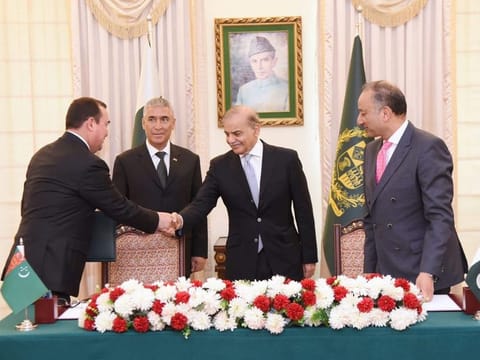 Pakistan’s Prime Minister Shehbaz Sharif and Turkmenistan State Minister Maksat Babayev shake hands at the signing ceremony of a joint implementation plan to expedite the TAPI gas pipeline project in Islamabad on June 8, 2023.  