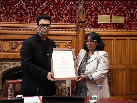  Bollywood director Karan Johar and Baroness Sandy Verma.