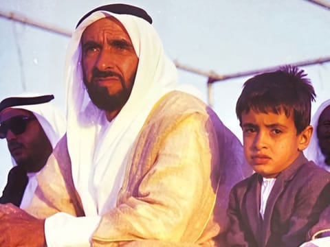 President His Highness Sheikh Mohamed bin Zayed Al Nahyan (right) in a childhood photo with his father, the late Sheikh Zayed bin Sultan Al Nahyan, the UAE's Founding Father 