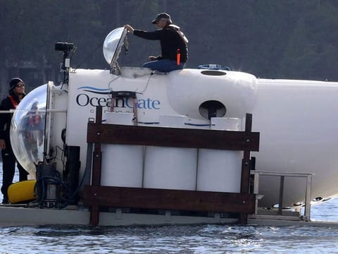 OceanGate CEO Stockton Rush emerges from the hatch atop the OceanGate submarine Cyclops 1 in the San Juan Islands on 2018. 