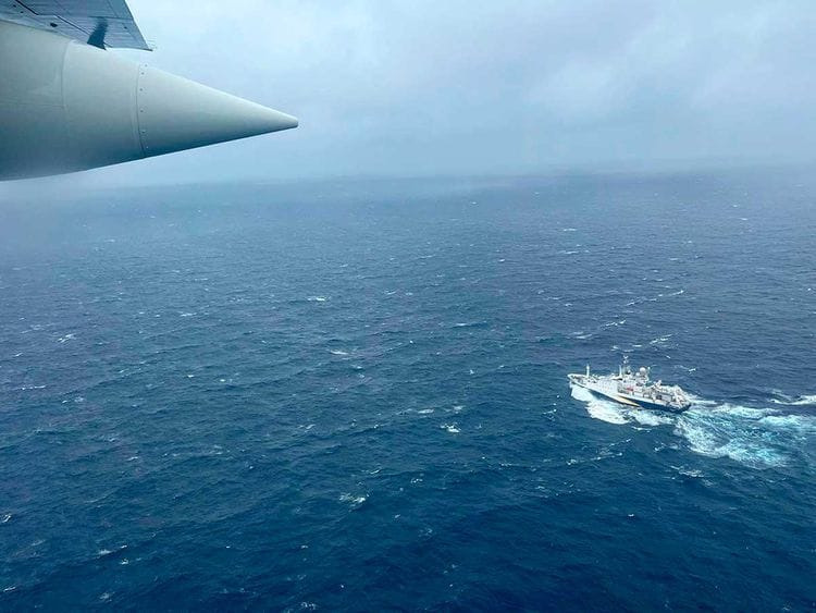 A US Coast Guard HC-130 Hercules airplane flies over the French research vessel, L'Atalante approximately 900 miles East of Cape Cod, during the search for the Titan submersible.
