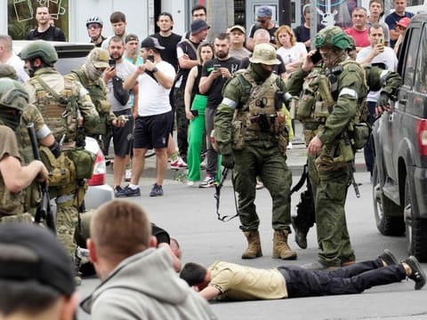 Members of Wagner group detain a man in the city of Rostov-on-Don, on June 24, 2023.  