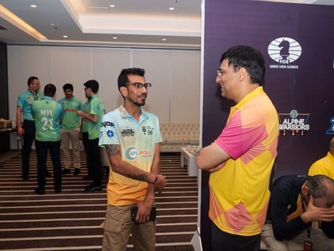 Indian cricketer Yuzvendra Chahal with Indian Grand Master Viswanathan Anand at the Global Chess League on Sunday.