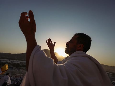 A pilgrim prays on the Mount Arafat during the annual Hajj pilgrimage on June 27, 2023. 
