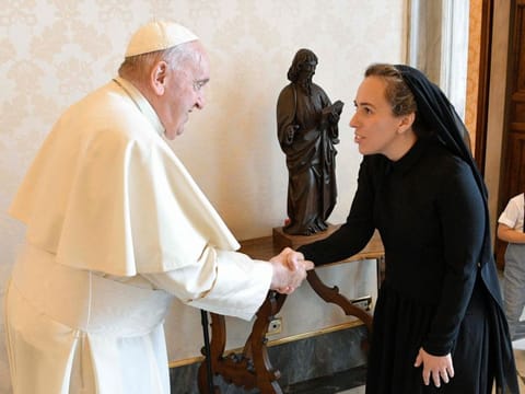 Pope Francis shaking hands with Stella Assange, wife of WikiLeaks founder Julian Assange, during a private audience in the Vatican. 