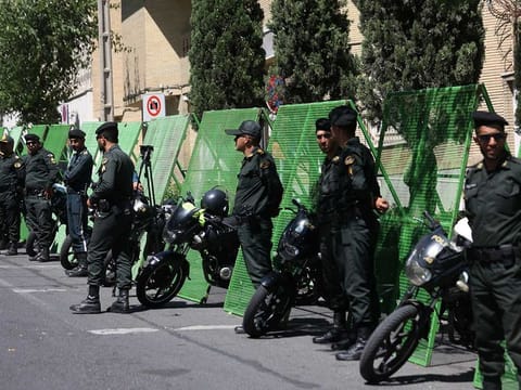 Police stand guard outside the Swedish Embassy during a protest against a man who burned a copy of the Holy Quran outside a mosque in the Swedish capital Stockholm, in Tehran, Iran June 30, 2023.