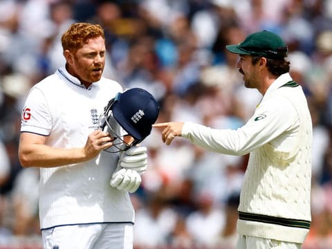 England's Jonny Bairstow speaks to Australia’s Travis Head after being run out by Alex Carey in the second Test of the Ashes cricket series on July 2, 2023. The dismissal sparked angry debates on the spirit of the games. 