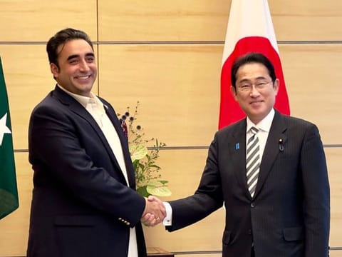 Pakistan’s Foreign Minister Bilawal Bhutto Zardari shakes hands with Japanese Prime Minister Fumio Kishida during a meeting in Tokyo on July 3, 2023. 