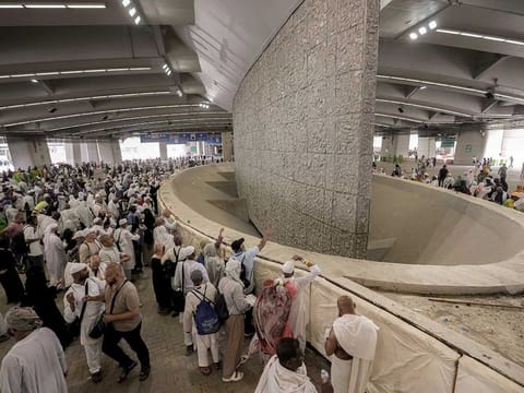 Pilgrims cast stones at a pillar in the symbolic stoning of the devil, the last rite of the annual Hajj pilgrimage, in Mina near the holly city of Mecca, Saudi Arabia, Thursday, June 29, 2023. 