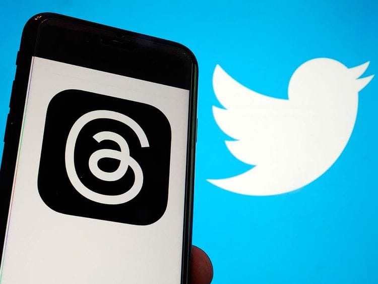 This photo shows the logo for Meta's new app Threads, left, and that of Twitter. 