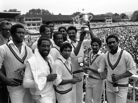 1979 — West Indies captain Clive Lloyd, surrounded by Vivian Richards, Alvin Kallicharan, Deryck Murray, Gordon Greenidge, Michael Holding, Joel Garner, Colin Croft and Collis King, displays the Prudential World Cup at Lord's. West Indies retained the cup with a 92-run victory over England in the final. 