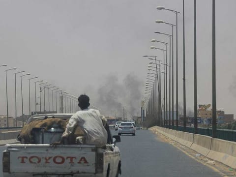 Smoke rises in Omdurman, near Halfaya Bridge, during clashes between the Paramilitary Rapid Support Forces and the army as seen from Khartoum North, Sudan, April 15, 2023. 