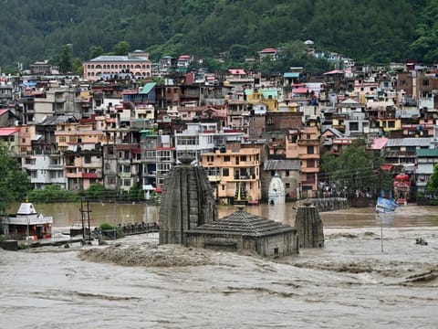 A submerged temple is pictured as the river Beas overflows following heavy rains in Mandi in the northern state of Himachal Pradesh.