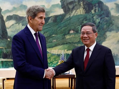 US Special Presidential Envoy for Climate John Kerry, left, and Chinese Premier Li Qiang shake hands before a meeting at the Great Hall of the People in Beijing Tuesday, July 18, 2023.