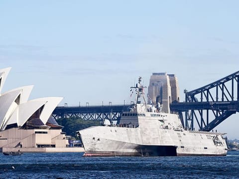 The USS Canberra (LCS-30) sails past the Sydney Opera House as it arrives at the Royal Australian Navy's Fleet Base East, in Sydney. 