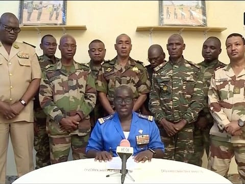 Niger Army spokesman Colonel Major Amadou Adramane speaks during an appearance on national television, after President Mohamed Bazoum was held in the presidential palace, in Niamey, Niger, on July 26, 2023 in this still image taken from video.  