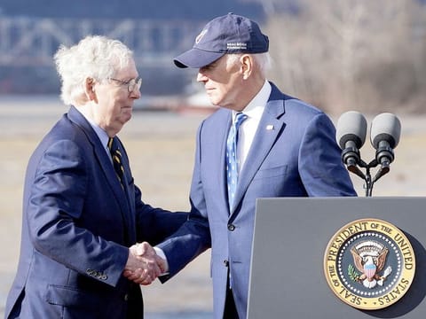 File photo: US President Joe Biden shakes hands with US Senate Republican Leader Mitch McConnell. 