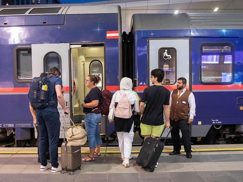 Passengers board the Nightjet train line Vienna - Venice (-Zurich) of the Austrian Federal Railways (OeBB) at the main station in Vienna, Austria.