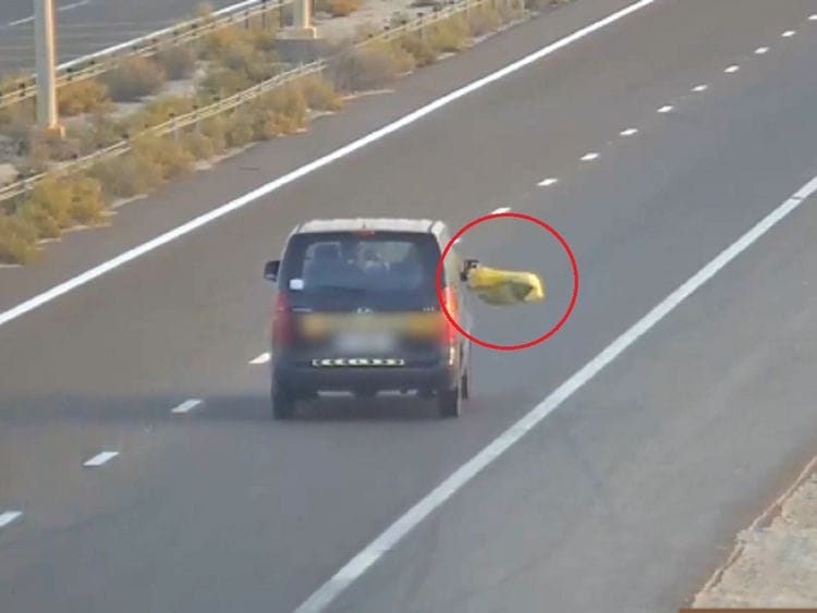 Trash from cars Abu Dhabi Police