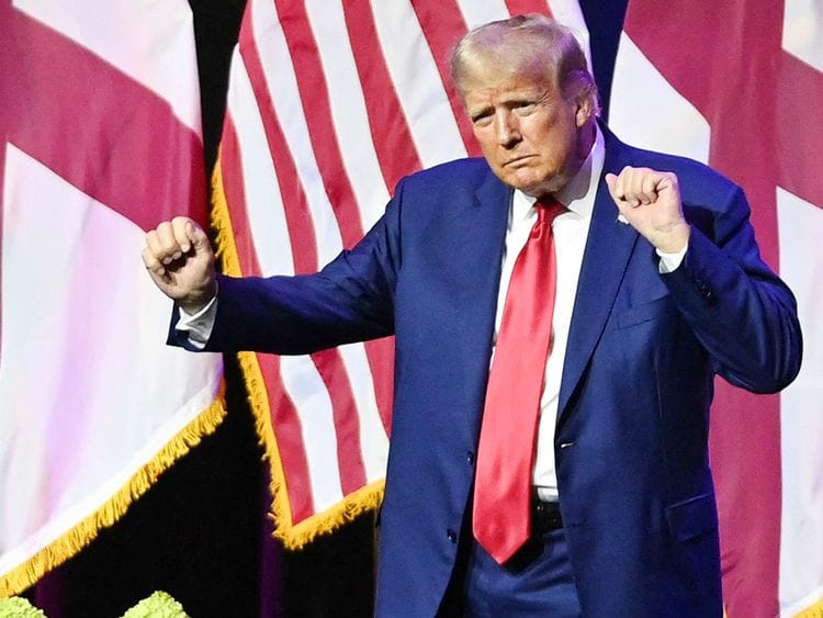 Donald Trump dances on stage 