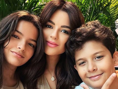 Sarah Abdallah, is a Dubai-based social media influencer, seen here with her two children, Olivia (left) and Christian (right). 