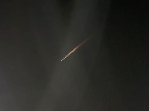 A streak of light, which the Australian Space Agency (ASA) identified as the probable remnants of a Russian rocket, is seen in the night sky, in Melbourne, Victoria.