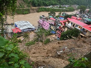 Photos: Heavy rains trigger floods and landslides in India's Himalayan region, leaving at least 50 dead