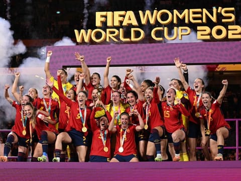Spain's players celebrate with the trophy after winning the Women's World Cup final against England at Stadium Australia in Sydney on Sunday.