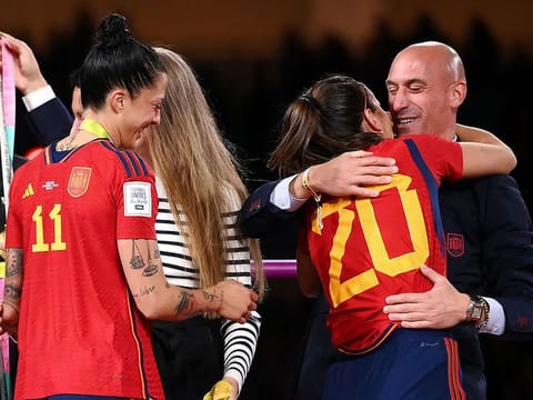 Spain's defender Rocio Galvez is congratuled by President of the Royal Spanish Football Federation Luis Rubiales (R) next to Spain's Jennifer Hermoso after winning the Australia and New Zealand 2023 Women's World Cup final football match between Spain and England at Stadium Australia in Sydney on August 20, 2023. 