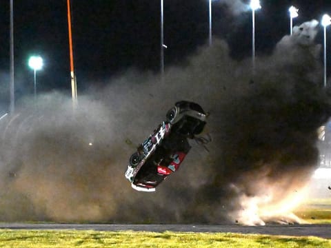 Ryan Preece barrel rolls along the back stretch during the NASCAR Cup Series auto race at Daytona International Speedway.