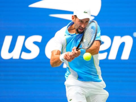 Novak Djokovic of Serbia hits to Bernabe Zapata Miralles of Spain on day three of the 2023 US Open tennis tournament at USTA Billie Jean King National Tennis Center. 