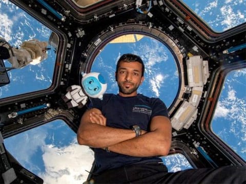 Emirati astronaut Sultan Al Neyadi on the International Space Station along with Suhail, the MBRSC mascot for the space mission. 
