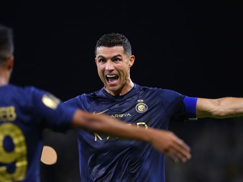 Nassr's Portuguese forward #07 Cristiano Ronaldo (R) celebrates with Nassr's Saudi midfielder #29 Abdulrahman Ghareeb after scoring a goal during the Saudi Pro League football match between Al-Nassr and Al-Hazem at the King Abdullah Sports City in Buraidah, on September 2, 2023.