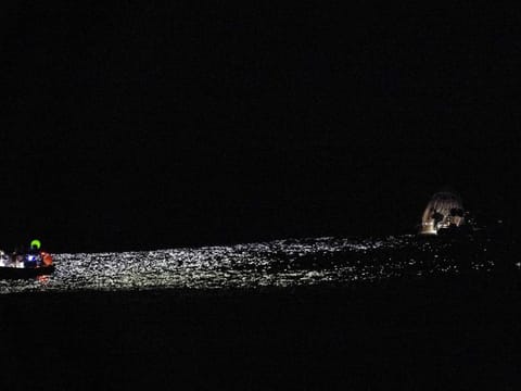 In this photo provided by NASA, support teams work around a SpaceX capsule shortly after it splashed down in the Atlantic Ocean off the coast of Jacksonville, Fla., Monday, Sept. 4, 2023, with NASA astronaut Stephen Bowen, United Arab Emirates astronaut Sultan al-Neyadi, NASA astronaut Warren (Woody) Hoburg and Roscosmos cosmonaut Andrei Fedyaev aboard after a six-month stay at the International Space Station. (Joel Kowsky/NASA via AP)