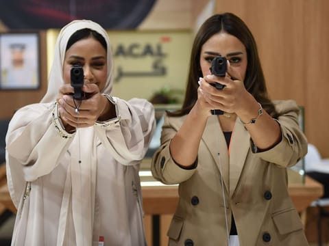 Visitors inspect pistol gun during the 20th edition of the Abu Dhabi International Hunting and Equestrian Exhibition (ADIHEX)  in Abu Dhabi National Exhibition Centre (ADNEC).  File photo
