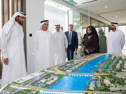Mattar Al Tayer (second from left), Director-General, Chairman of the Board of Executive Directors, RTA, and Mohammed Ibrahim Al Shaibani (left), Chairman of the Board of Directors, Nakheel, next to a model of the project
