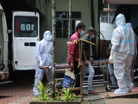 Health workers wearing protective gear shift people who have been in contact with a person infected with the Nipah virus to an isolation centre at a goverment hospital in Kozikode, in India's Kerala state on September 14, 2023. 