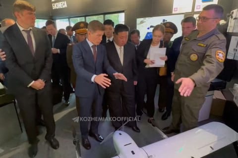 This video grab taken from footage posted on the official Telegram account of Primorsky region governor Oleg Kozhemyako on September 17, 2023, shows North Korea's leader Kim Jong Un (centre) accompanied by Governor of Primorsky region Oleg Kozhemyako (centre left) visiting an exhibition of military and dual-use goods in Vladivostok.  