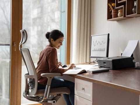 A comfortable office chair that provides back support will help minimise the long-term damage of being seated for long hours.