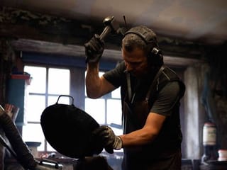 Photos: Bavarian hammersmith forges wrought-iron pans at a mill more than 500 years old