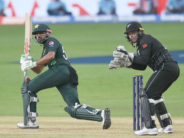 Pakistan’s captain Babar Azam (left) plays a shot 