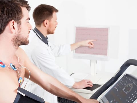 Routine investigations play a pivotal role in the diagnostic process. A doctor shows the patient an ECG recording of the heart's status.